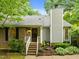 Charming home featuring brick accents, siding, chimney and landscaped garden beds, providing a welcoming curb appeal at 173 Clancy Cir, Cary, NC 27511