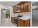 A view of the kitchen showing the new appliances, refinished cabinets, and eat-in breakfast area at 173 Clancy Cir, Cary, NC 27511