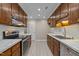 Modern kitchen with stainless steel appliances, sleek countertops, and bright white subway tile backsplash, stylish and functional at 173 Clancy Cir, Cary, NC 27511