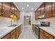 Stylish kitchen featuring modern countertops, stainless steel appliances, and ample cabinet space with a modern aesthetic at 173 Clancy Cir, Cary, NC 27511