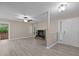 Inviting living area featuring modern flooring, a charming fireplace, and easy access to the front door and patio at 173 Clancy Cir, Cary, NC 27511