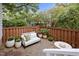 Outdoor patio area with stylish seating and green plants at 173 Clancy Cir, Cary, NC 27511