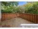 Patio area with a wooden fence and ample space at 173 Clancy Cir, Cary, NC 27511
