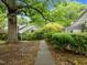 Scenic walkway lined with lush greenery leading to the house at 173 Clancy Cir, Cary, NC 27511