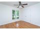 Bedroom with hardwood floors, a large closet, a ceiling fan, and a window at 175 Fox Run Rd, Youngsville, NC 27596