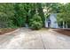 Long, paved driveway that leads to the house and a shed in the backyard at 175 Fox Run Rd, Youngsville, NC 27596