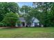 Charming single-story home featuring a well-manicured lawn and mature trees for added privacy at 175 Fox Run Rd, Youngsville, NC 27596