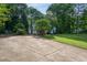 House with a driveway surrounded by woods in the front yard at 175 Fox Run Rd, Youngsville, NC 27596