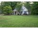 View of the home from the front yard with a neatly kept green lawn at 175 Fox Run Rd, Youngsville, NC 27596