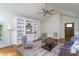 Spacious living area with hardwood floors, a ceiling fan, and lots of natural light at 175 Fox Run Rd, Youngsville, NC 27596