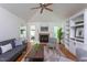 Comfortable living room boasts a fireplace, vaulted ceiling, and stylish furnishings at 175 Fox Run Rd, Youngsville, NC 27596