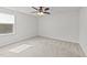 Comfortable bedroom features plush carpeting, neutral paint, and a ceiling fan at 188 Karlov Rd, Garner, NC 27529