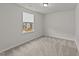 Bedroom with plush carpeting and lots of natural light for a comfortable space at 188 Karlov Rd, Garner, NC 27529