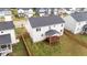 Aerial view of home's backyard with wood fence and covered back porch at 188 Karlov Rd, Garner, NC 27529