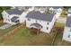 Aerial view of home's backyard with wood fence and covered back porch at 188 Karlov Rd, Garner, NC 27529