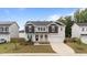 Charming two-story home with landscaped yard, black shutters, and attached two-car garage at 188 Karlov Rd, Garner, NC 27529