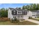 Charming two-story home with landscaped yard, black shutters, and attached two-car garage at 188 Karlov Rd, Garner, NC 27529