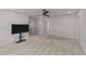 Second-story living room with plush carpet and ceiling fan at 188 Karlov Rd, Garner, NC 27529