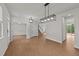 Spacious open-concept living room with wood floors and recessed lighting, and staircase at 188 Karlov Rd, Garner, NC 27529