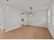 Spacious open-concept living room with wood floors and recessed lighting at 188 Karlov Rd, Garner, NC 27529
