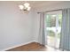 Dining room has hardwood floors and a sliding door to the backyard at 1924 Barngate Way, Raleigh, NC 27614