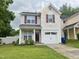 Charming two-story home featuring a one-car garage, landscaped yard, and inviting front porch at 1924 Barngate Way, Raleigh, NC 27614
