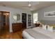 Inviting bedroom featuring hardwood floors, a ceiling fan, and ample closet space at 201 Cooke St, Raleigh, NC 27601