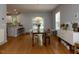 Dining area with hardwood floors, a modern light fixture, and French doors leading to the outside at 201 Cooke St, Raleigh, NC 27601