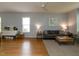 Bright and spacious living room with hardwood floors, neutral walls, and large windows at 201 Cooke St, Raleigh, NC 27601
