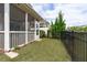 The fenced backyard has green grass and room to run in a community with similar houses nearby at 210 Mayfield Dr, Apex, NC 27539