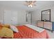 Bedroom with ceiling fan and view to closet and ensuite bathroom at 210 Mayfield Dr, Apex, NC 27539