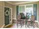 Inviting front porch featuring outdoor seating, a welcome mat, and decorative accents at 210 Mayfield Dr, Apex, NC 27539