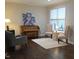 Cozy living room featuring hardwood floors, natural light, and comfortable seating at 210 Mayfield Dr, Apex, NC 27539