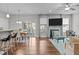 Spacious living area with fireplace, hardwood floors, and access to the outdoor patio at 210 Mayfield Dr, Apex, NC 27539