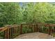Wooden deck with lush green views at 214 Cedar Elm Rd, Durham, NC 27713