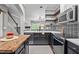 Well-appointed kitchen featuring white cabinets, stylish backsplash, and modern appliances at 214 Cedar Elm Rd, Durham, NC 27713
