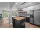 Modern kitchen with stainless steel appliances, island, and an open design at 214 Cedar Elm Rd, Durham, NC 27713