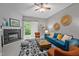 Comfortable living room with a fireplace, blue sofa and decorative touches at 214 Cedar Elm Rd, Durham, NC 27713