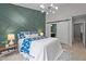 Stylish main bedroom featuring a decorative accent wall and a sliding barn door to ensuite bathroom at 214 Cedar Elm Rd, Durham, NC 27713