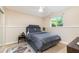 Cozy bedroom with soft carpet and a view from the window at 2216 Lawrence Dr, Raleigh, NC 27603