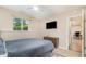 Bedroom with a view to the kitchen and a flatscreen TV at 2216 Lawrence Dr, Raleigh, NC 27603