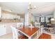 Open concept: Dining area connecting kitchen and living room, with lots of light and modern decor at 2216 Lawrence Dr, Raleigh, NC 27603
