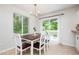 Cozy dining area with natural light, featuring table with chairs and a slider to a patio at 2216 Lawrence Dr, Raleigh, NC 27603
