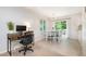 Bright dining area featuring a view of the outdoor patio with modern table and chairs at 2216 Lawrence Dr, Raleigh, NC 27603