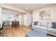 Open-concept living room and dining area featuring modern decor and hardwood floors at 2216 Lawrence Dr, Raleigh, NC 27603