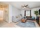 Inviting living room with neutral walls, ceiling fan, and comfortable seating arrangement at 2216 Lawrence Dr, Raleigh, NC 27603