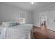 Bedroom with hardwood floors and kitchen access at 2227 Us-15, Creedmoor, NC 27522