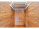 Cedar closet with hanging rod and wood plank construction at 2227 Us-15, Creedmoor, NC 27522