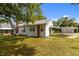 Exterior of the home includes metal roof, white siding, and covered parking at 2227 Us-15, Creedmoor, NC 27522