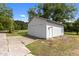Exterior of the detached garage featuring a large door and a separate entrance at 2227 Us-15, Creedmoor, NC 27522